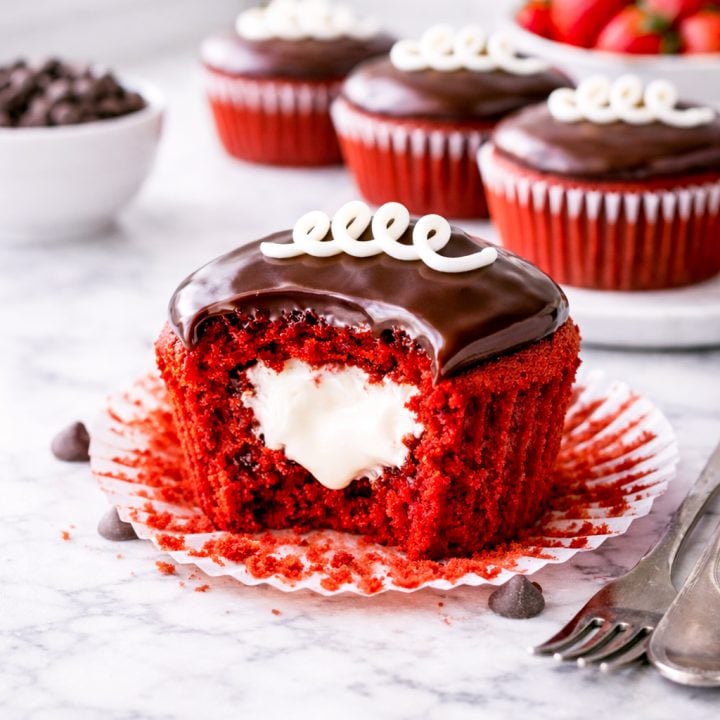 These homemade red velvet Hostess cupcakes have a creamy vanilla filling, glossy chocolate ganache, and the classic white swirl on top. A nostalgic dessert that’s even better than the store-bought version!