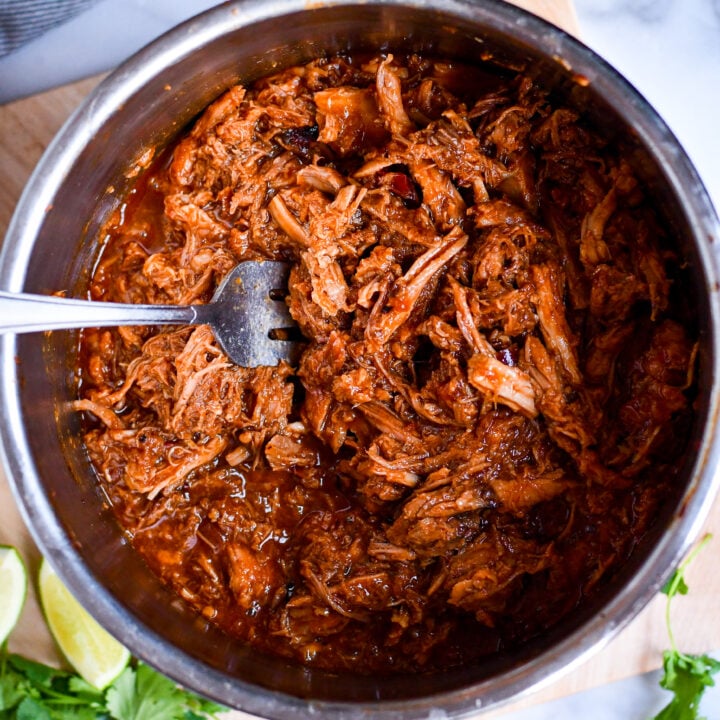 Slow cooked to perfection, this sweet pork recipe tastes just like Cafe Rio! Great for burritos, salads, and more.